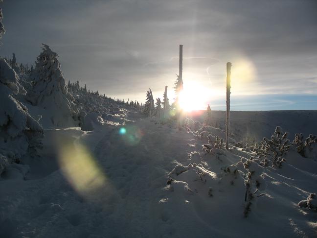 sun sets behind the hill