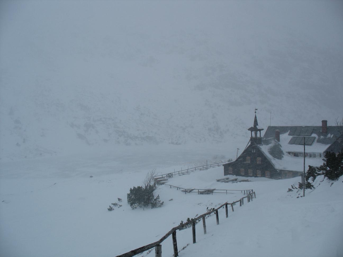 snow blizzard near mountain hostel